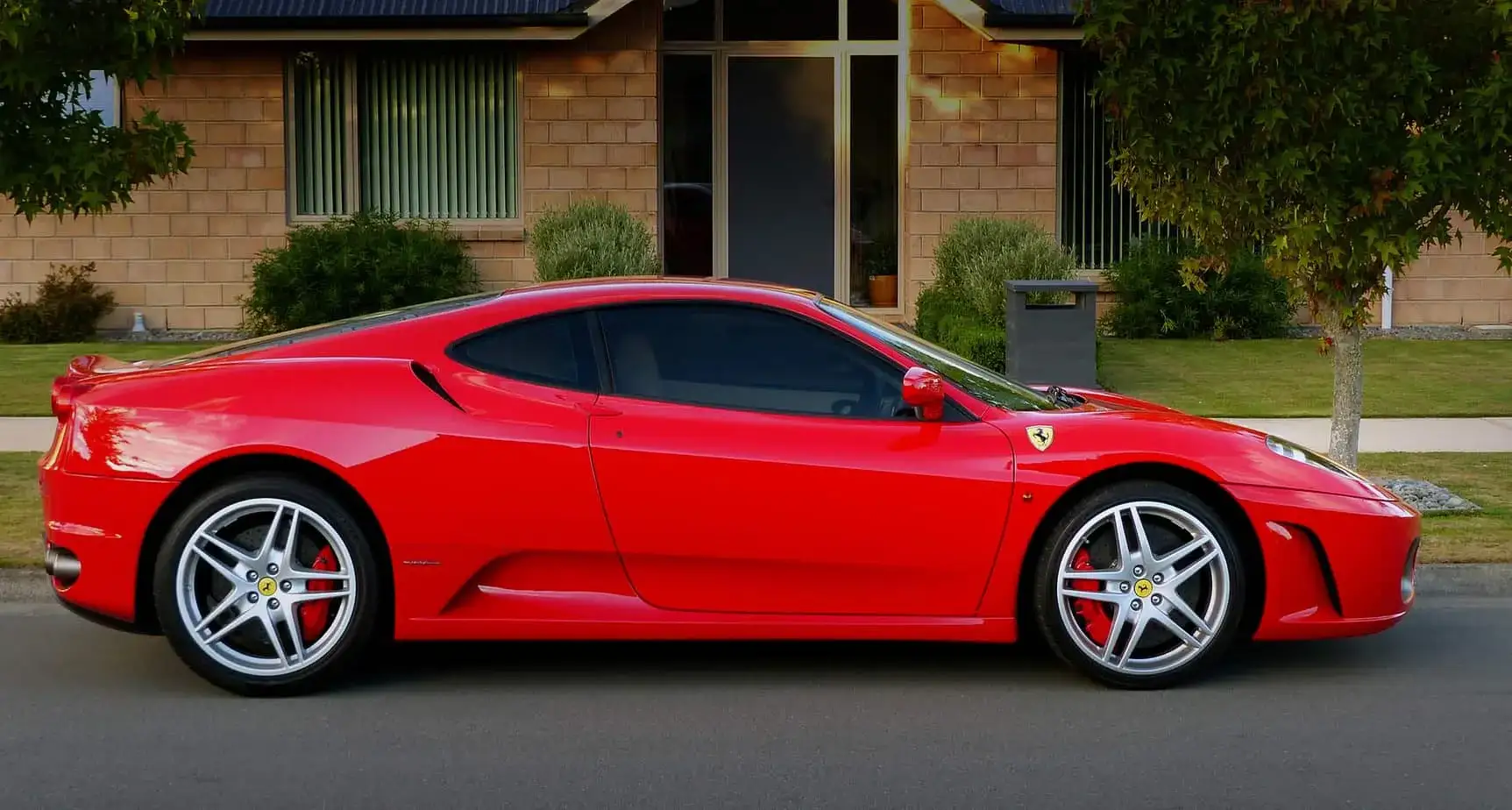 Laval exotic car on flatbed soft-strap transport